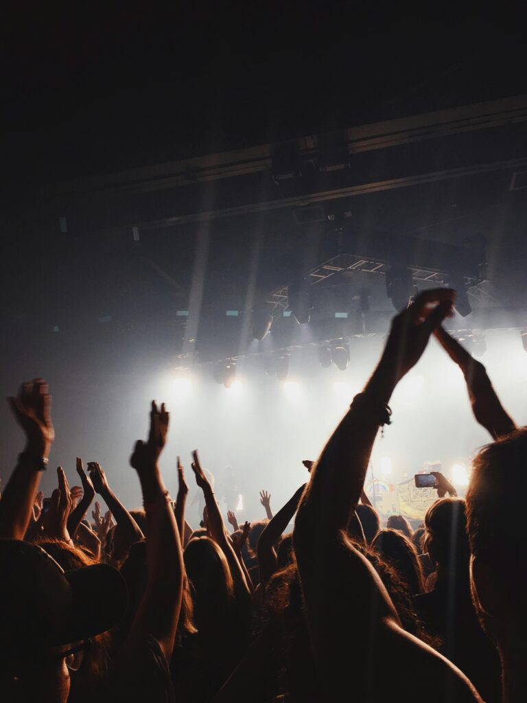 pexels-photo-2147029-2147029 Vibrant concert atmosphere with cheering crowd under spotlights and lively music.